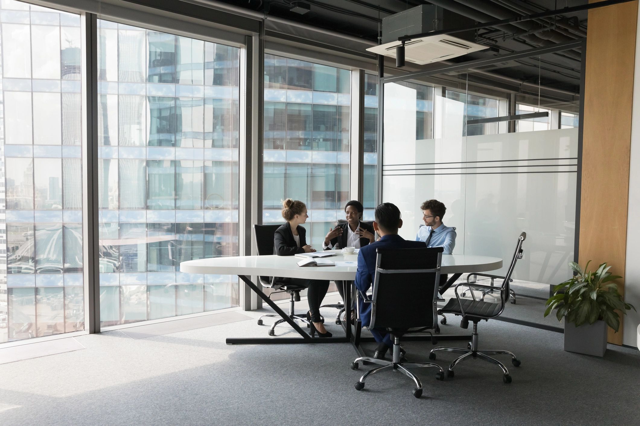 Logistics team meeting in modern office