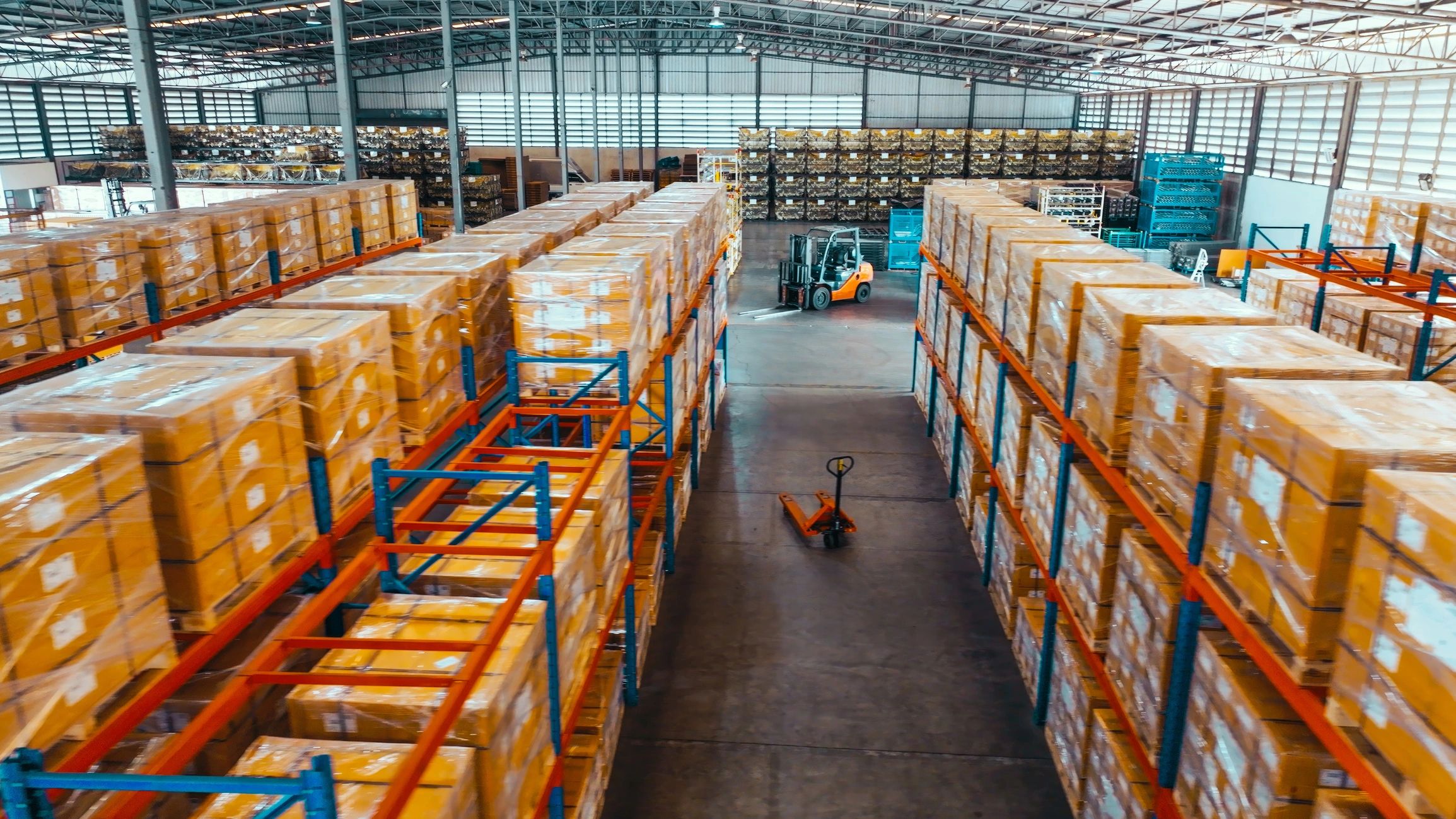 Warehouse shelves with packaged goods in logistics facility